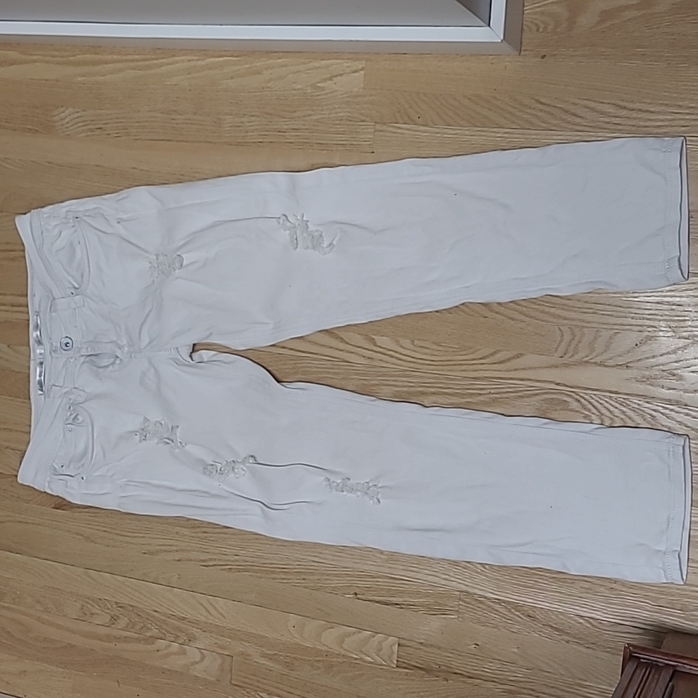 Distressed white jeans